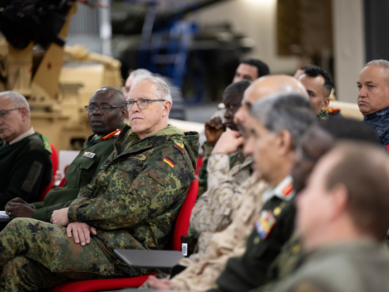 International Defence Attaches sat listing to a presentation.