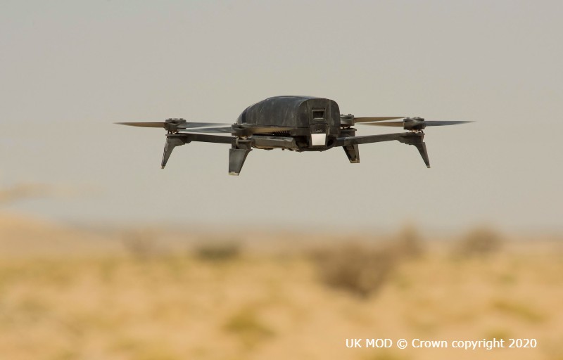 A drone in the air in the desert