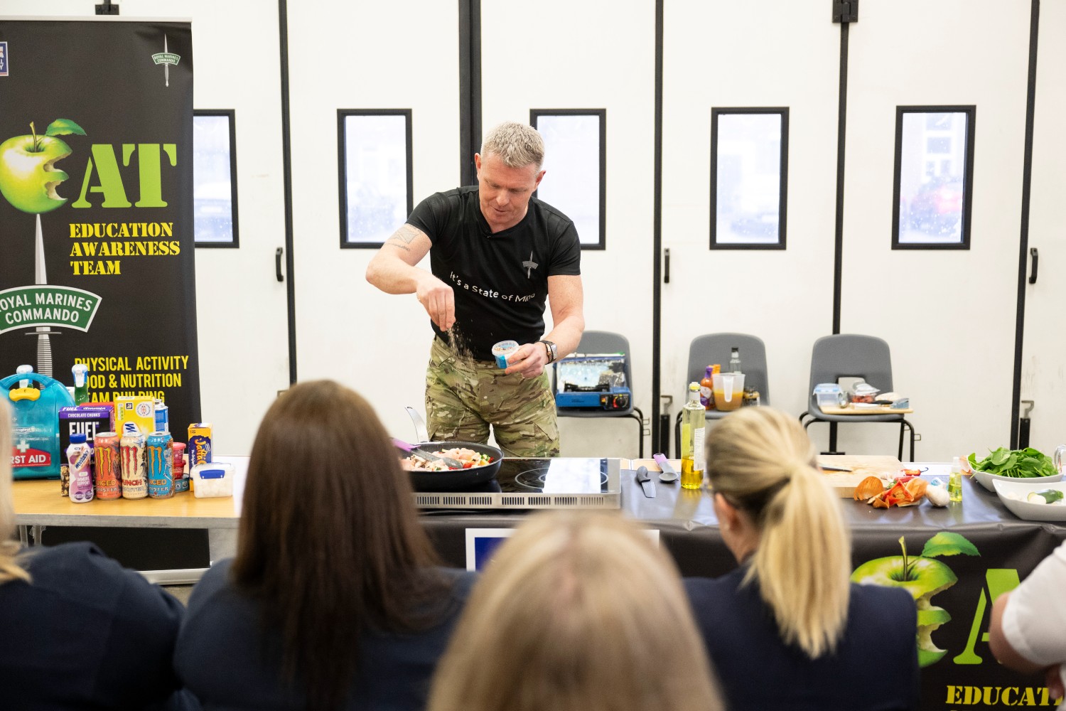 Commando Chef giving a demo with an audience.