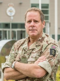 Profile of Lt Gen Copinger-Symes in Army combats with arms folded.