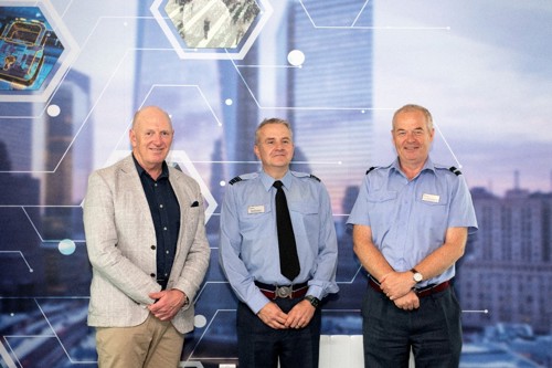 Australian Defence Force, Chief of Joint Capabilities, Lt Gen JJ Frewen and Deputy Commandant of the Defence Academy UK, Air Cmdre Hamish Cormack stood in front of a cyber banner.