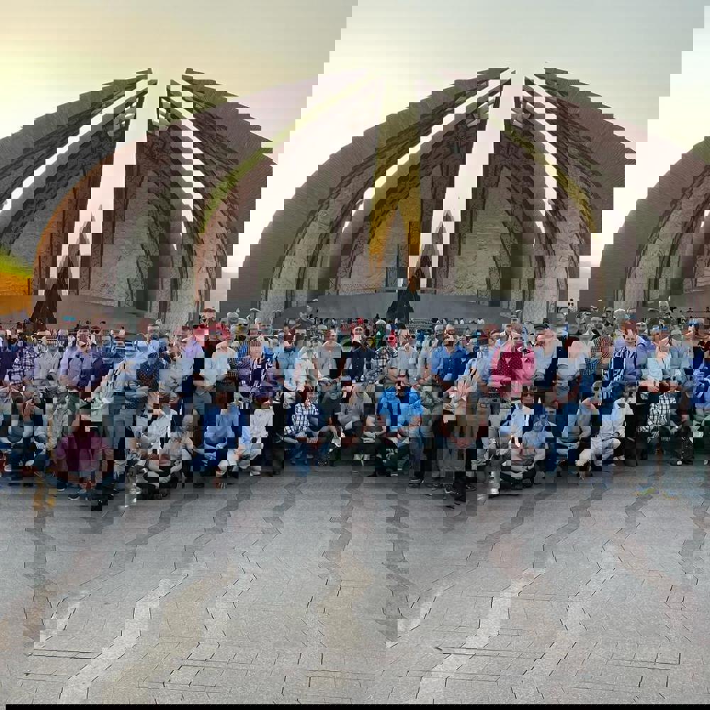Course members stood in front of an impressive landmark in Pakistan