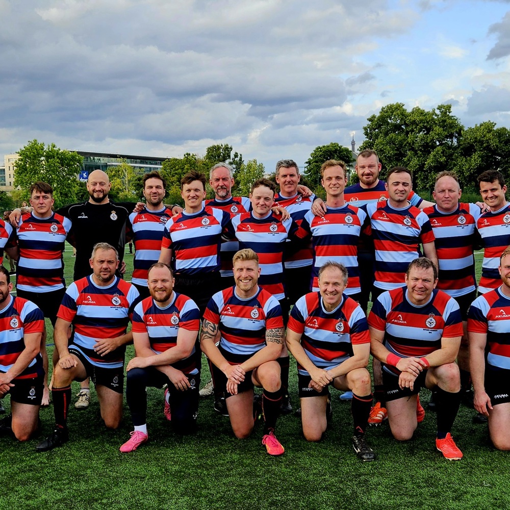 The Defence Academy rugby team in uniform on the pitch.