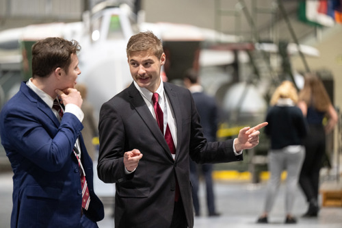 Men suits with a Tornado GR4 in the background. 