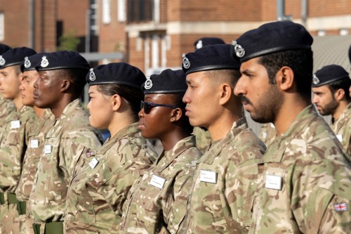 Army cadet stood for inspection during parade.