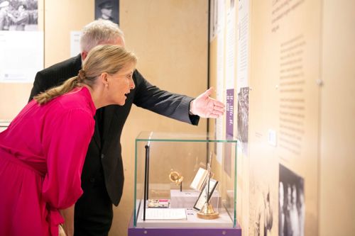 HRH The Countess of Wessex looking at a Victoria Cross exhibit that was awarded to her great uncle, Padre Noel Meliish during WW1.