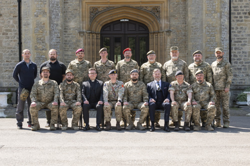 Group photo of Ukrainian chaplains outside Beckett House entrance.