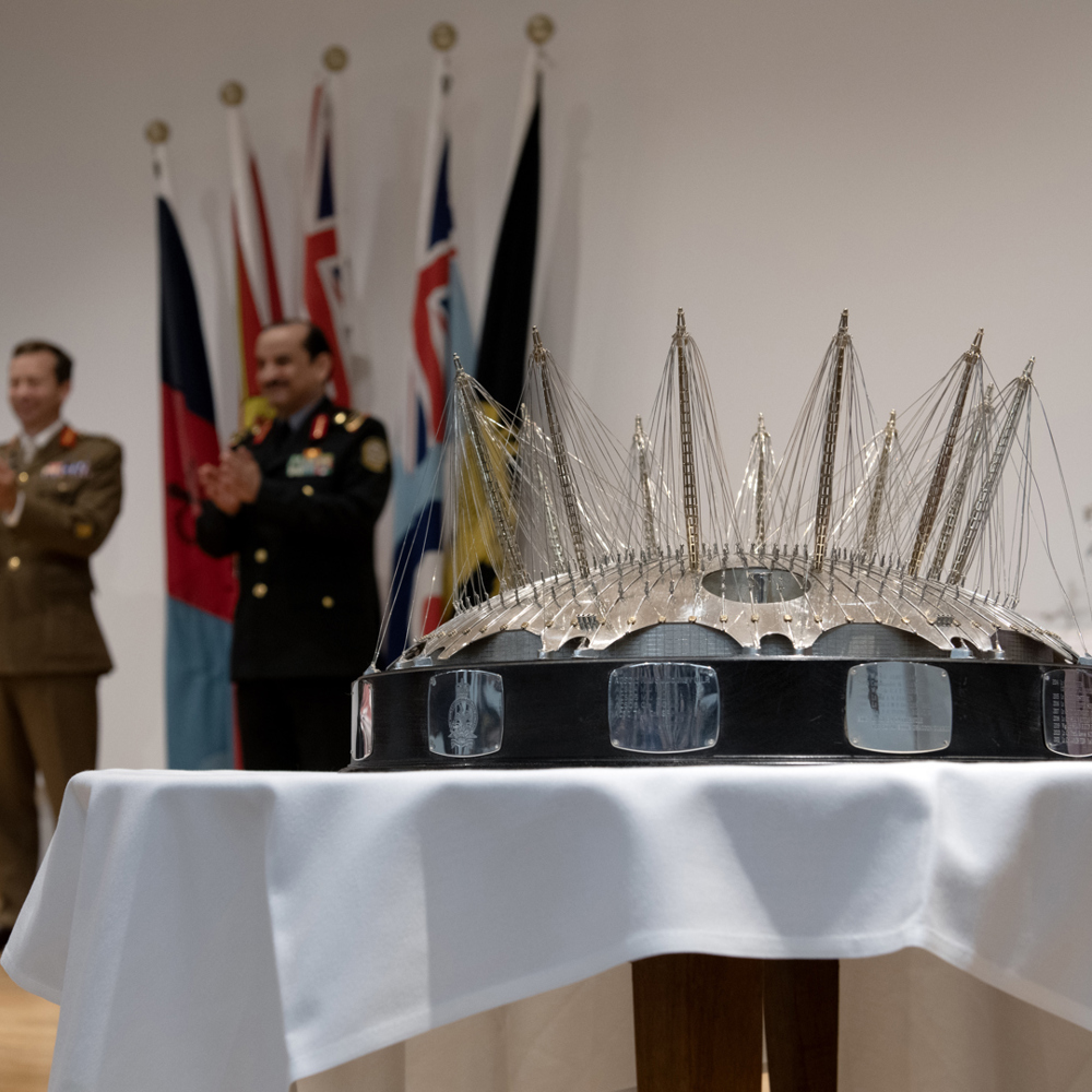 Silver O2 trophy on a table.