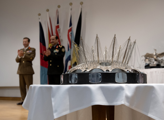 Silver O2 trophy on a table.