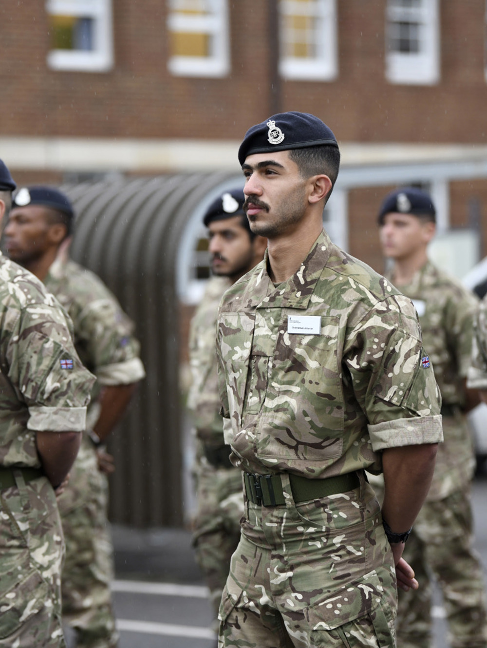A young international student stood outside on parade.