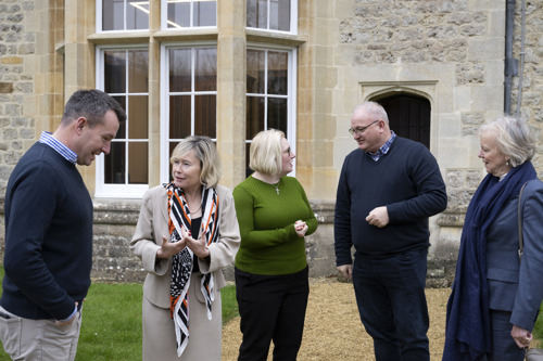 Peers and MPs having a group discussion outside Beckett House
