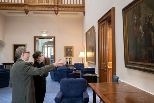 Moderator of Scotland and Reverand looking at an oil painting.