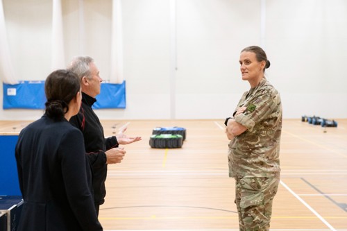 PT staff talking to Heather Stanning inside the Sports Hall's fitness centre.