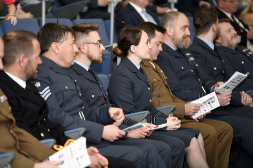 A mixture of male and female students sat in an auditorium 