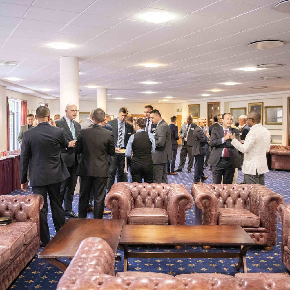 SSLP delegates sat in leather chairs conversing.