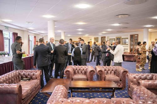 SSLP delegates sat in leather chairs conversing.