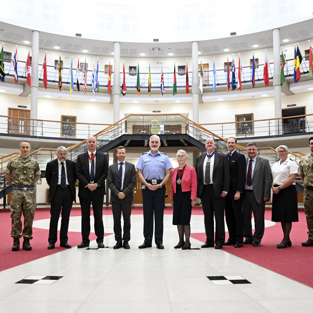 A group of people stood inside the Forum, Cormorant building, in recognition of their awards from the Worshipful Company of Educators. 