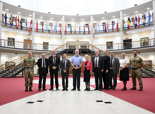 A group of people stood inside the Forum, Cormorant building, in recognition of their awards from the Worshipful Company of Educators. 