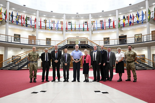 A group of people stood inside the Forum, Cormorant building, in recognition of their awards from the Worshipful Company of Educators. 
